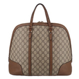 Brown GG canvas dome handle bag with front leather panels and metal handle hardware