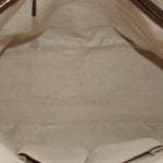 Cream fabric interior lining with seam detail inside dome handle bag