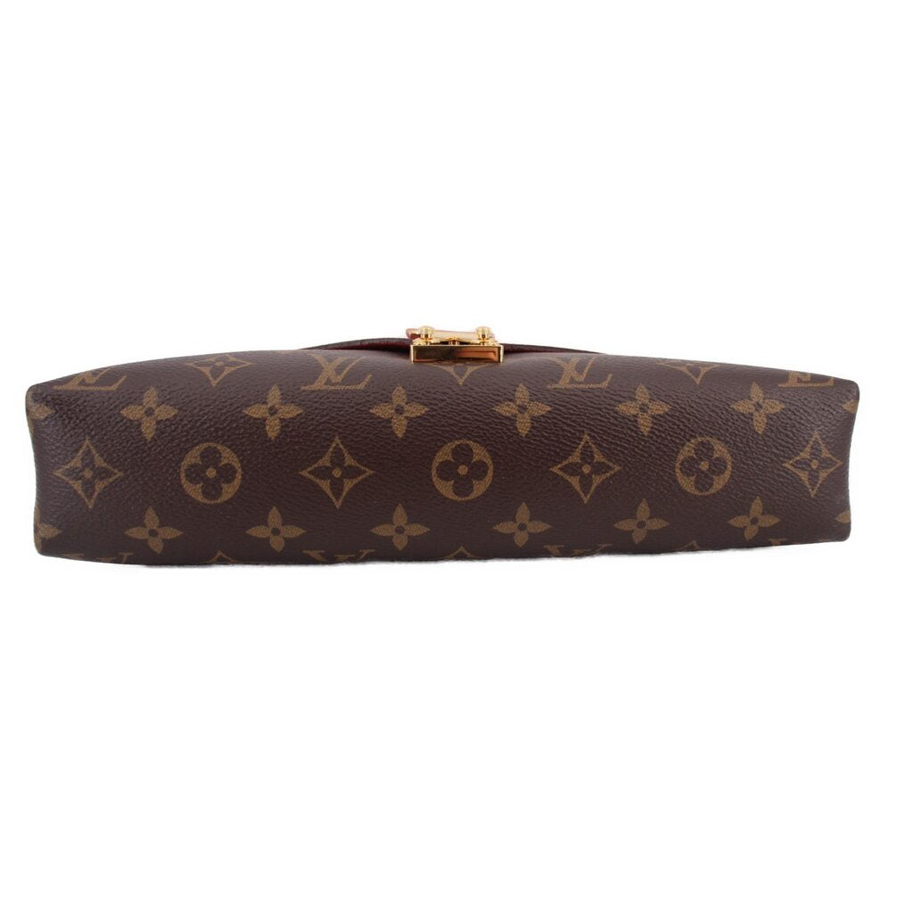 Long monogram crossbody bag with gold-tone clasp hardware at center top