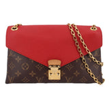 Red and brown monogram crossbody bag with gold-tone chain strap and flap closure