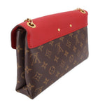 Red-trim monogram crossbody bag with gold-tone top ring hardware and folded flap