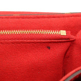 Close-up of red interior zipper and seam on crossbody bag