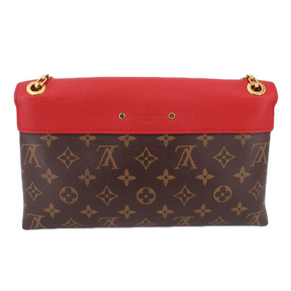 Small red flap crossbody bag with monogram canvas front and two gold-tone eyelets
