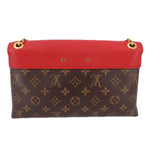Small red flap crossbody bag with monogram canvas front and two gold-tone eyelets
