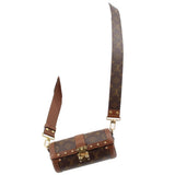 Monogram crossbody trunk bag with adjustable strap and gold-tone hardware