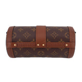 Monogram cylindrical trunk bag with front clasp and brown leather trim