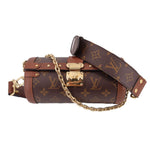 Monogrammed crossbody trunk bag with top handle and chain strap, brown leather trims
