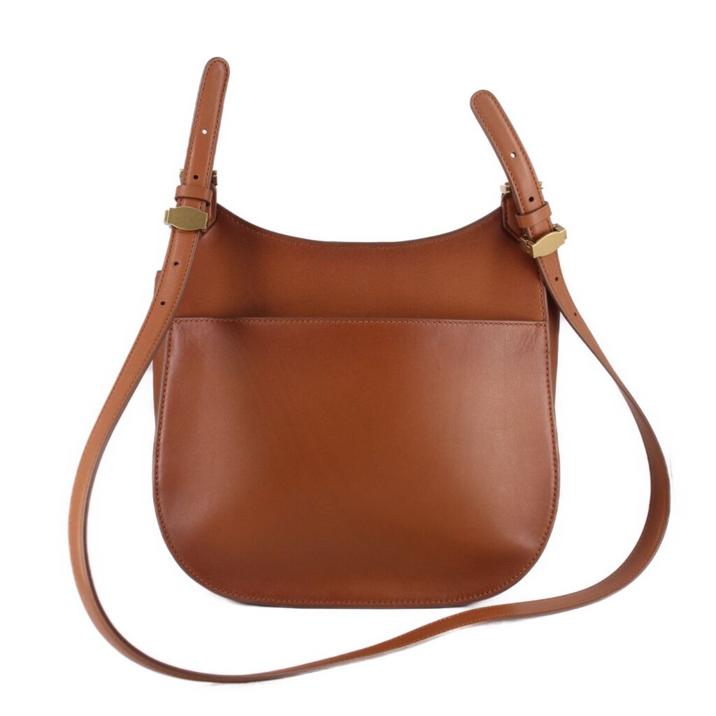 Cognac leather crossbody bag with curved front panel and adjustable shoulder straps
