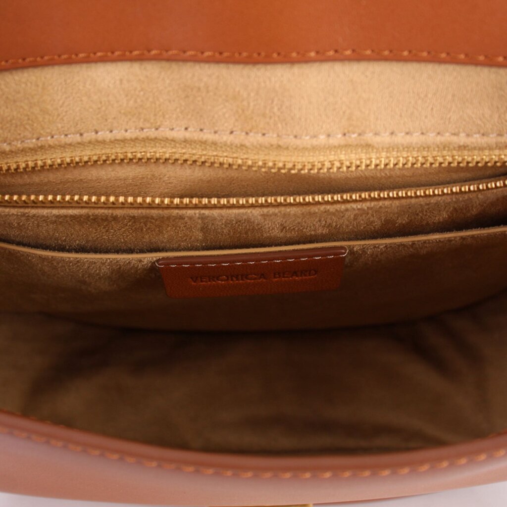 Cognac leather crossbody bag interior with zip pocket and VERONICA BEARD label