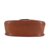 Cognac leather crossbody bag with smooth flat base and wide strap loops