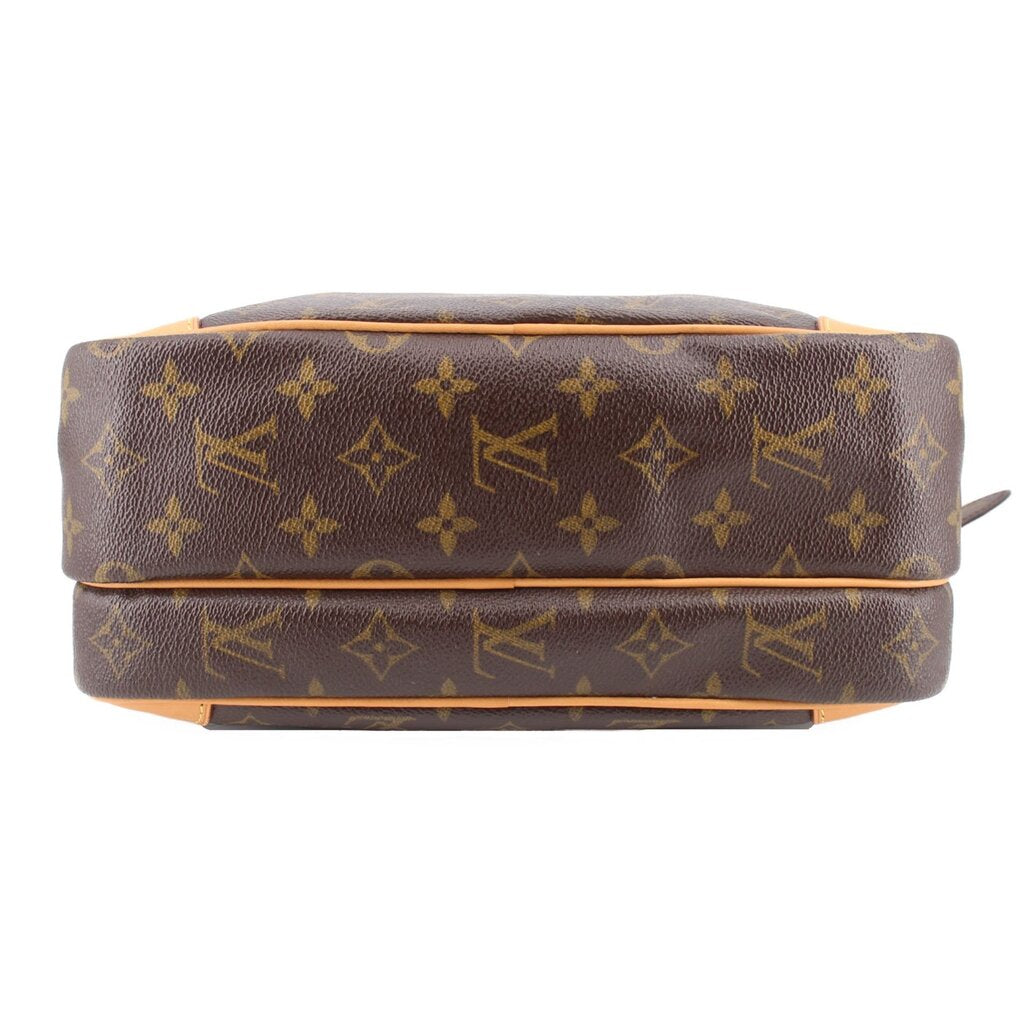 Monogram crossbody bag bottom view with stitched tan trim and flat base