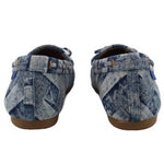 Blue denim loafers with back collar and small strap detail at heel