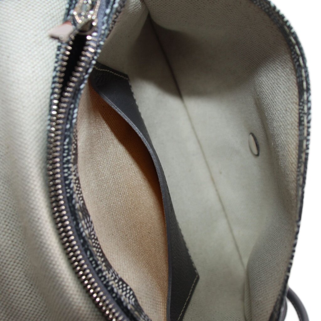 Inside view of gray patterned crossbody wallet with zip pocket and lining