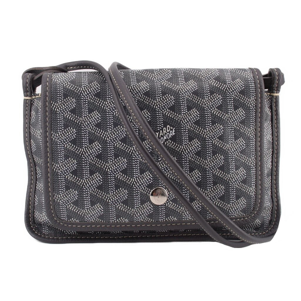Gray patterned crossbody wallet with flap, leather trim, and adjustable shoulder strap