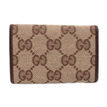 Brown Gucci tri-fold key case, front panel in GG monogram canvas