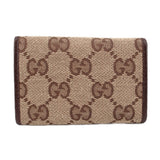 Brown Gucci tri-fold key case, front panel in GG monogram canvas