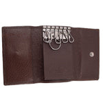 Brown Gucci tri-fold key case interior with key hooks and snap button