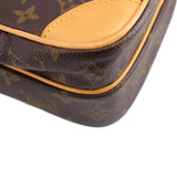 LOUIS VUITTON monogram crossbody bag corner close-up, tan piping and pebbled texture