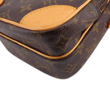 LOUIS VUITTON monogram crossbody bag bottom corner close-up, tan trim and rounded edge