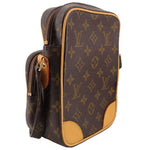 LOUIS VUITTON monogram crossbody bag side view, zip compartments and tan leather trim
