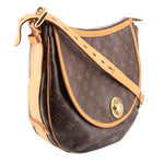 Louis Vuitton Tulum GM crossbody bag side view, monogram canvas, tan shoulder strap