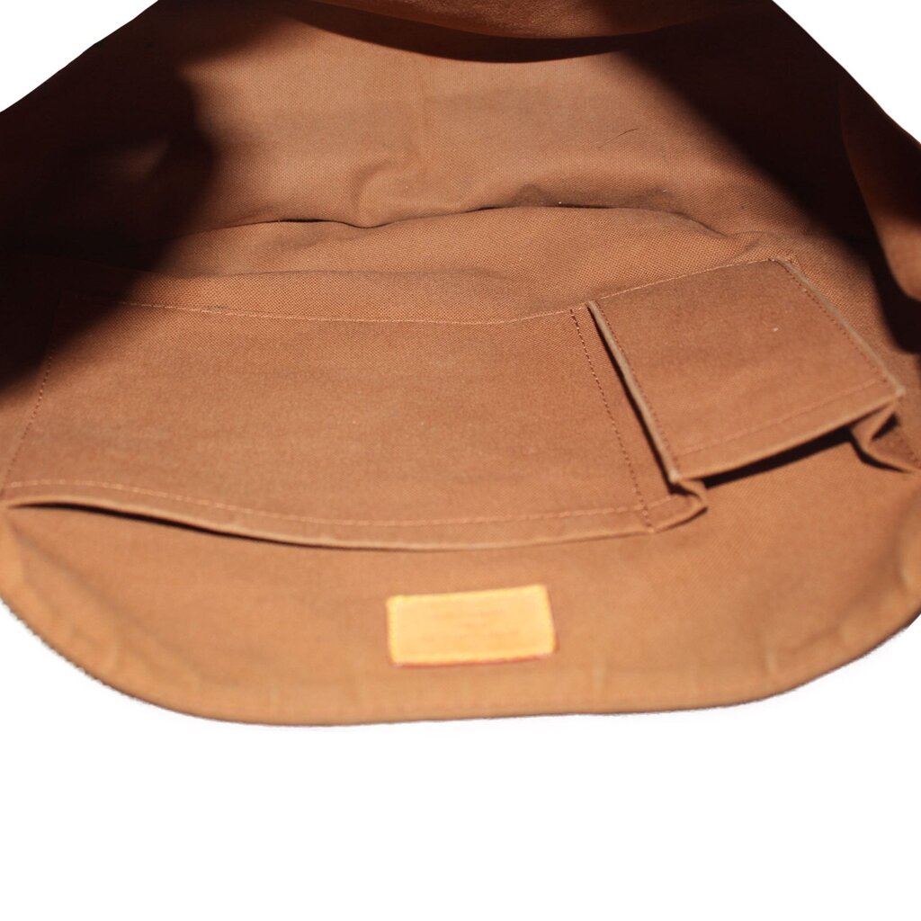 Louis Vuitton Tulum GM crossbody bag interior, tan lining with slip pocket