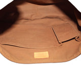 Louis Vuitton Tulum GM crossbody bag interior, tan lining with slip pocket