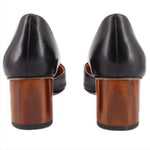 Black leather heels with stacked wooden heel and back seam detail