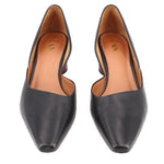 Pair of black leather pointed-toe heels with tan insole and stitched collar