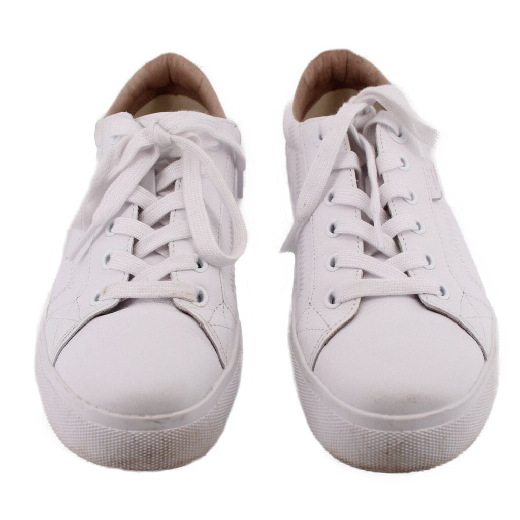 Pair of white leather sneakers, toe view with lace-up uppers