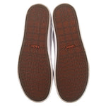 White leather sneaker insoles showing 'taos' pattern and logo