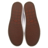 White leather sneaker insoles showing 'taos' pattern and logo