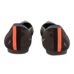 Back view of camo flats with green-brown pattern and orange heel stripe, blue trim