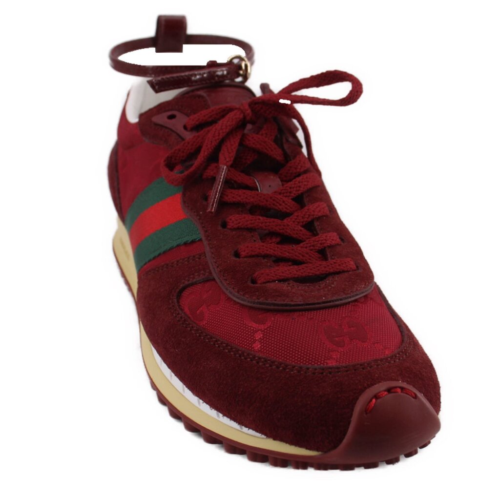Red suede high-top sneakers with lace-up front and chunky beige rubber sole