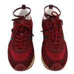 Pair of red lace-up sneakers with textured suede panels and beige outsoles