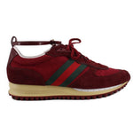 Red lace-up sneakers with green-and-red side stripes and beige rubber sole