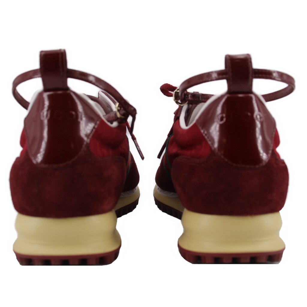 Red suede sneakers from the back with heel pull tabs and beige rugged outsole