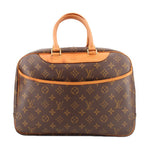 Louis Vuitton Deauville monogram travel bag with tan leather handles and trim