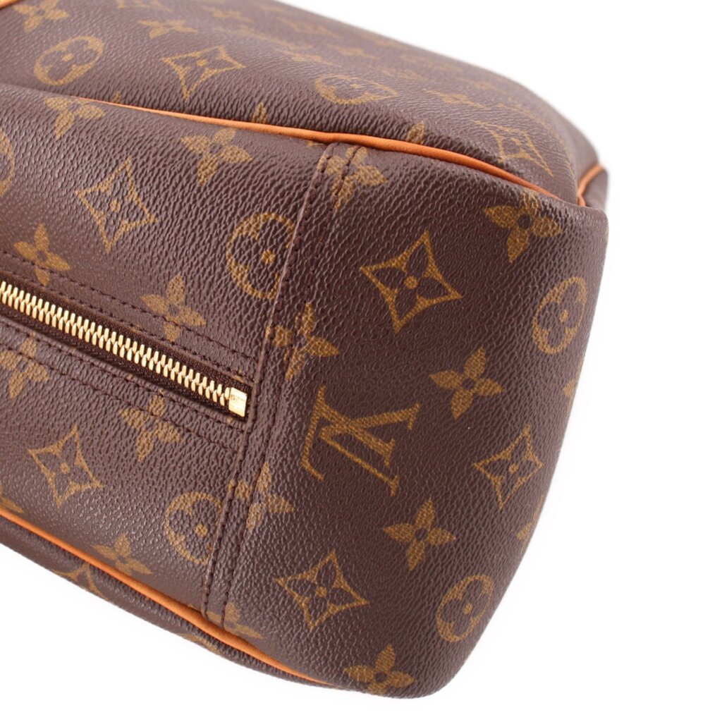 Louis Vuitton Deauville monogram bag close-up of side zipper and tan piping