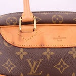 Louis Vuitton Deauville travel bag monogram, leather handle and tan trim close-up