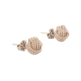 Gold-tone braided knot stud earrings with small floral detail on posts (pair)