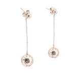 Ball drop earrings with small flower-like studs and long chain, round silver-tone dangles