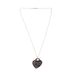 Silver heart pendant necklace with dark heart charm on a thin chain