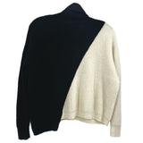 Two-tone turtleneck sweater, black and cream panels, back view, long sleeves.