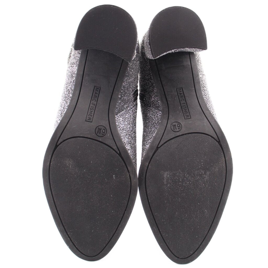 Rubber outsole of metallic silver ankle booties with size markings