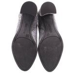 Rubber outsole of metallic silver ankle booties with size markings
