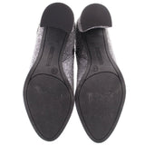 Rubber outsole of metallic silver ankle booties with size markings