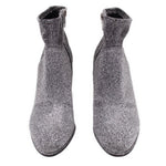 Metallic silver ankle bootie pair with side zippers and short shaft