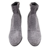 Metallic silver ankle bootie pair with side zippers and short shaft