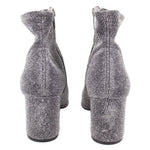 Metallic silver ankle bootie pair showing chunky block heel and side seams